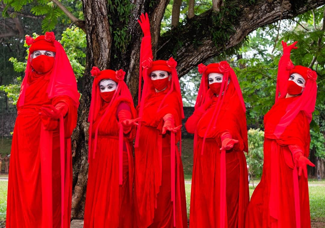 XRebellionLK's tweet photo. The Red Rebel Brigade made its first appearance in SL on the 19th March Climate Action to #stopecocidesl. They are a group dedicated to the global #climateemergencgy and supports #ExtinctionRebellion to save all species from Extinction.♥️#lka https://t.co/sNOYCsTvMp