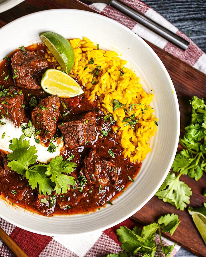 should_make's tweet photo. One more big bowl of comfort food before we head into a stretch of warm spring weather! This Mexican beef stew is hearty, with a little heat and delicious served with a scoop of yellow rice, homemade lime crema, and a squeeze of lime. New on the blog! https://t.co/jP9zZovabc