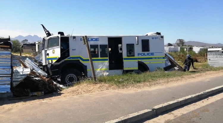 EFFWesternCape_'s tweet photo. It has been brought to the attention of the EFF WC that a police vehicle veered off the road and damaged people’s structures in Kraaifonten.  As the party we condemn this action by the police and call for those police officers implicated to be brought to book.  @SAPoliceService https://t.co/PmSvmcOsA7