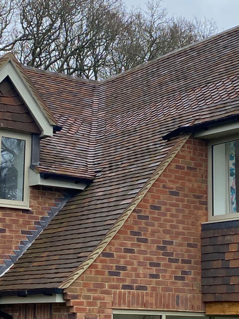 LifestilesLtd's tweet photo. Did you know we manufacture a range of decorative tiles? This project in Sussex made use of our Woburn Reclamation club tiles to provide an additional feature #lifestiles #clayrooftiles #roofing https://t.co/B7OKCXLDIi
