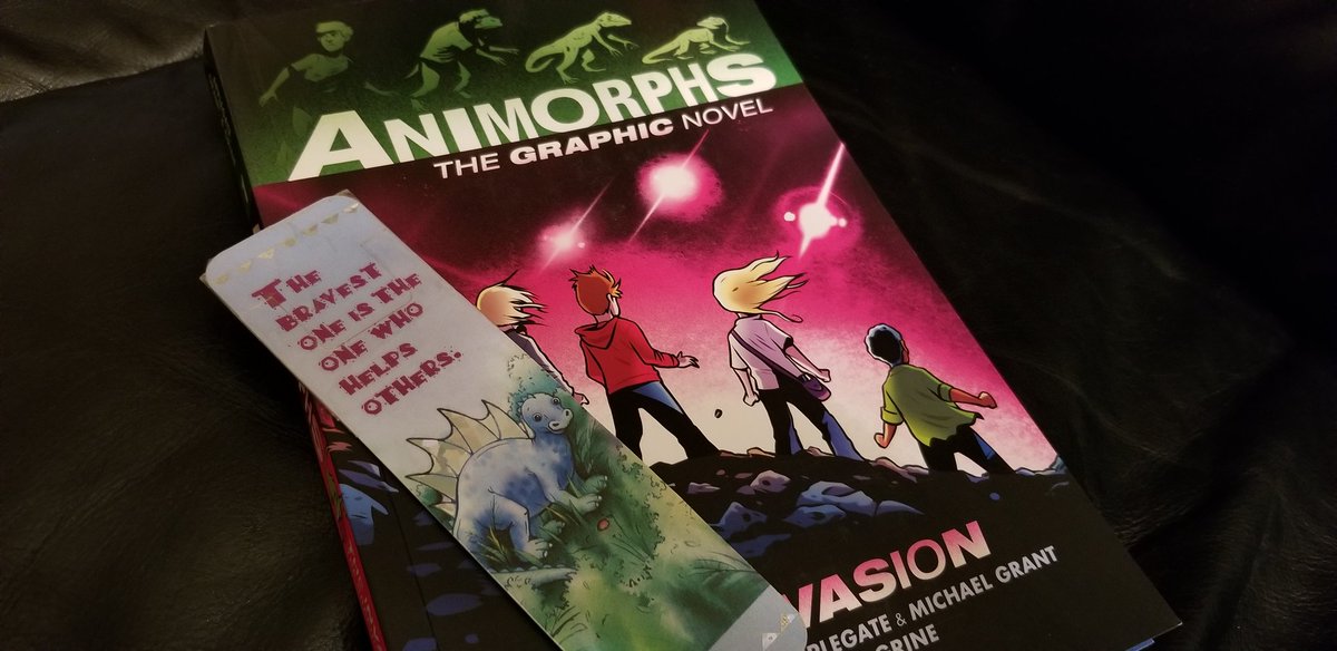 bitter_sky's tweet photo. Book fair in 97. Got a book because of a lizard and a bookmark with a dino. Of course I got the dino bookmark out for the lizard book again. https://t.co/Fru09Pht36