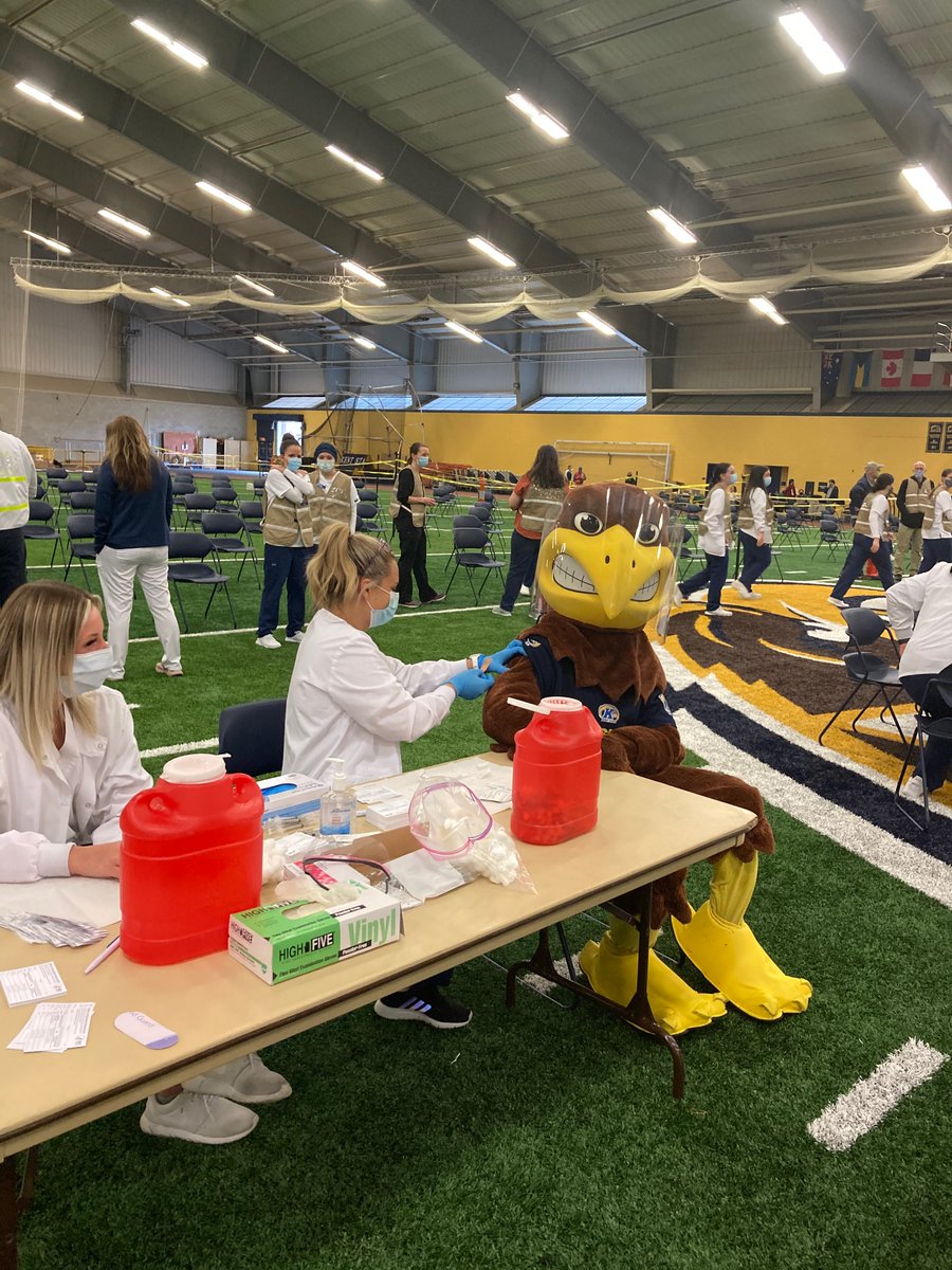kentnursing's tweet photo. .@kentnursing students and faculty volunteers helped make the initial mass COVID-19 vaccination site at the @kentstate Field House possible. The @PortageCoHealth will hold a vaccination clinic every Tuesday at the field house this spring. Learn more: https://t.co/GwdtmxVxi2. https://t.co/NAenvjKhEi