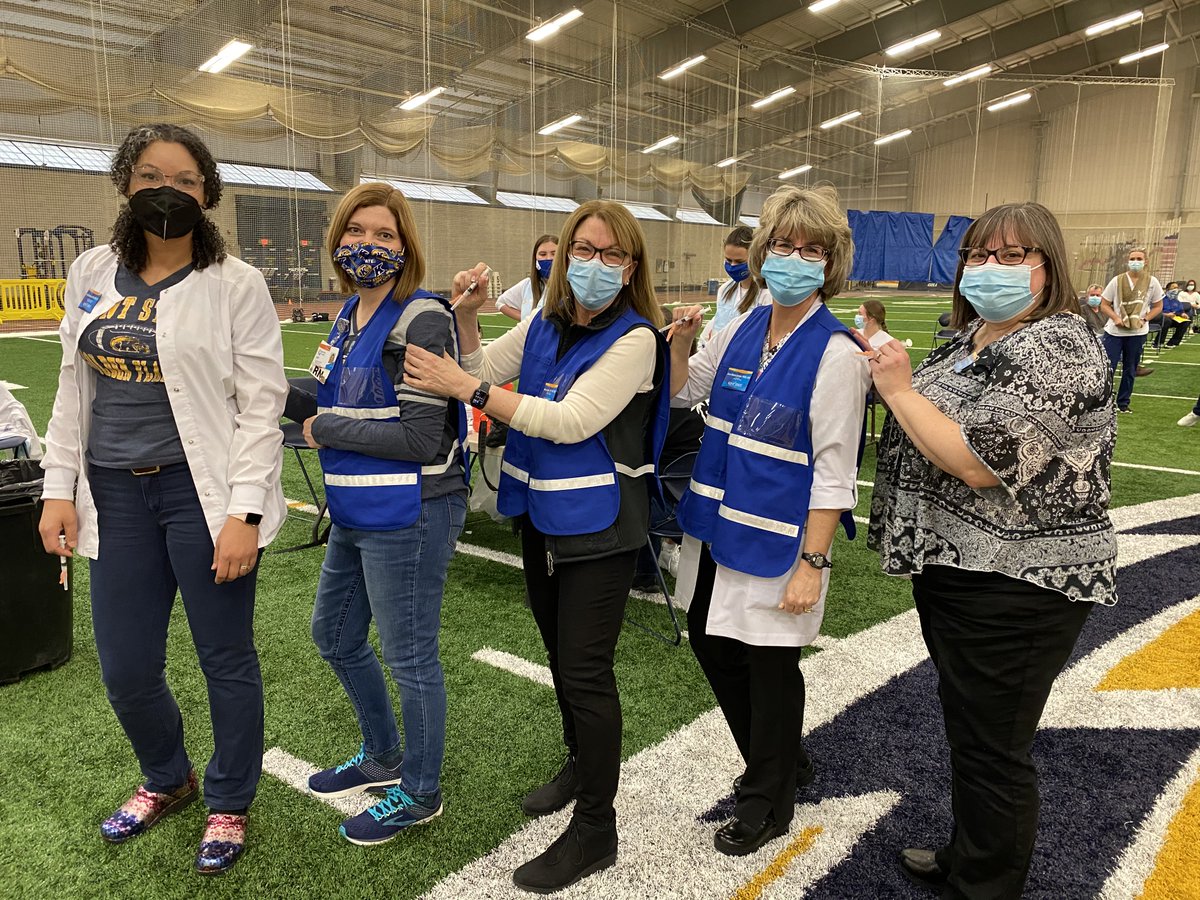 kentnursing's tweet photo. .@kentnursing students and faculty volunteers helped make the initial mass COVID-19 vaccination site at the @kentstate Field House possible. The @PortageCoHealth will hold a vaccination clinic every Tuesday at the field house this spring. Learn more: https://t.co/GwdtmxVxi2. https://t.co/NAenvjKhEi