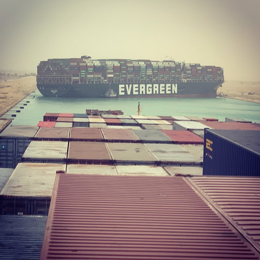 UFOchronpodcast's tweet image. Captain: &apos;Wait! I forgot my mask turn this ship around&apos;.
#everydayproblems

Suez Canal,  one of the largest shipping lanes on the planet, blocked with a mega container ship, creating a traffic jam of ships waiting in the Mediterranean, Red Sea, and in the canal itself.
