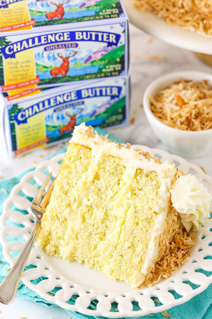 Coconut Custard Cake! #AD Layers of moist coconut cake, a creamy coconut custard and coconut cream cheese frosting! Made with my favorite <a href="/challengedairy/">Challenge Dairy</a> butter! lifeloveandsugar.com/coconut-custar… #challengebutter #MadewithChallenge #cake #Easter2021