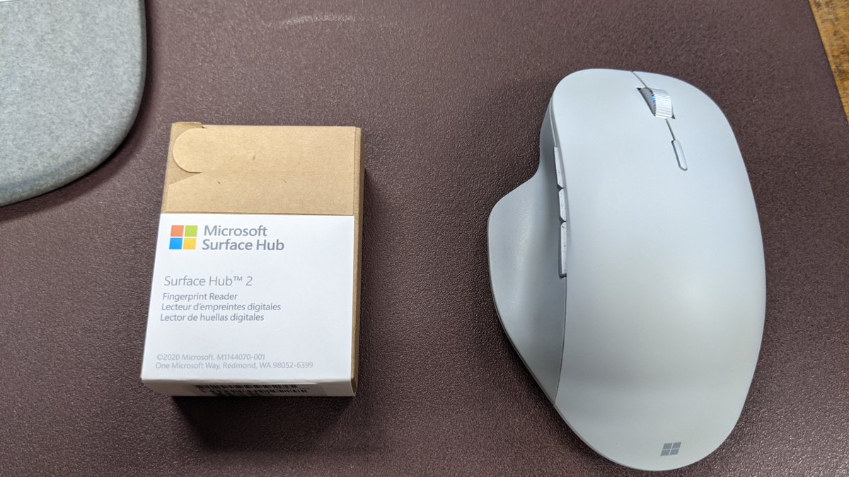 bricomp's tweet photo. Tiny little #SurfaceHub2 thumbprint scanner (mouse for comparison). Easy to install - push into USB-C port and done. Thank you @surface @y0avb https://t.co/4Lby9jYHgF