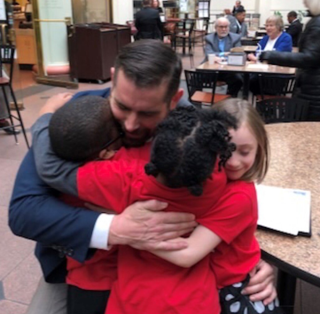 RepSims's tweet photo. Cute kid alert! @CleanAirMoms_PA remembers fondly this pre-pandemic moment in Harrisburg when a few of our #KidsCleanAirForce hit Rep Sims with a surprise #HugAttack! https://t.co/fB9iPeBQkW