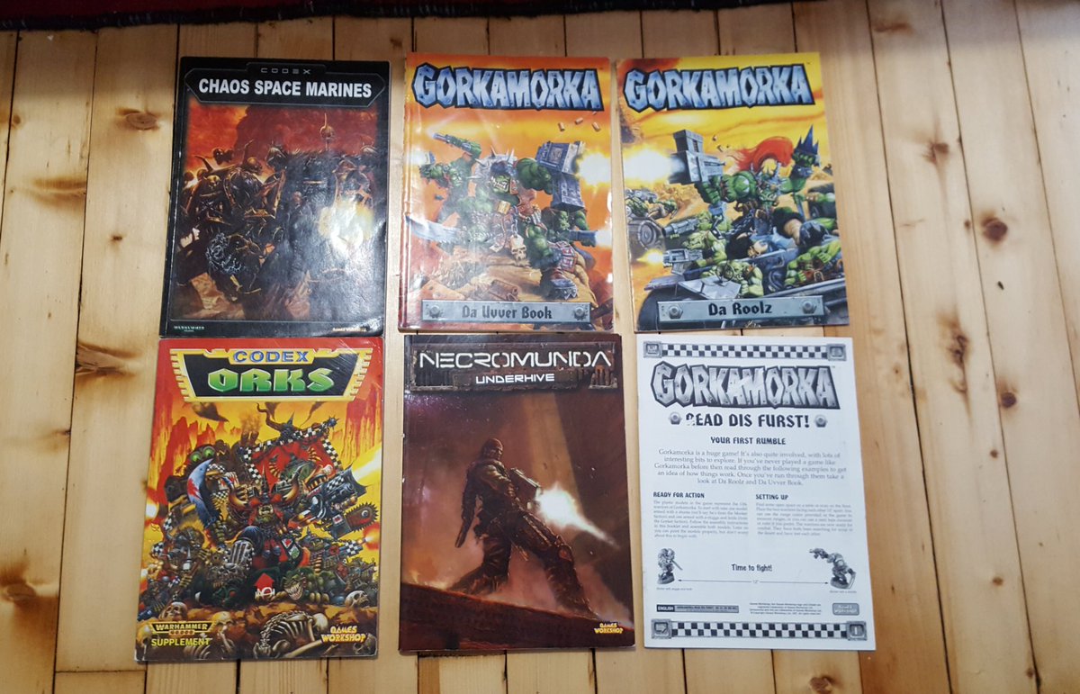 A photo of the Gorkamorka rulebook, along with a chaos and ork codex
