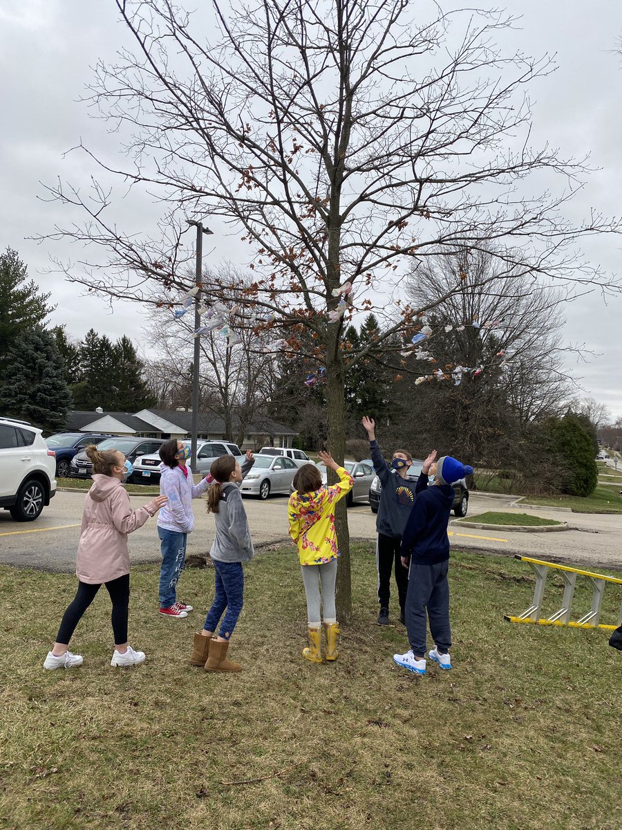 TeachMsErickson's tweet photo. We folded origami flowers, wrote our stressors, then hung them in a tree to say Farewell to them! We used biodegradable paper and string. Here are some pictures from #FarewellDay @McDermottdg58 #dg58pride #BArocks https://t.co/XDSxKx4tQq