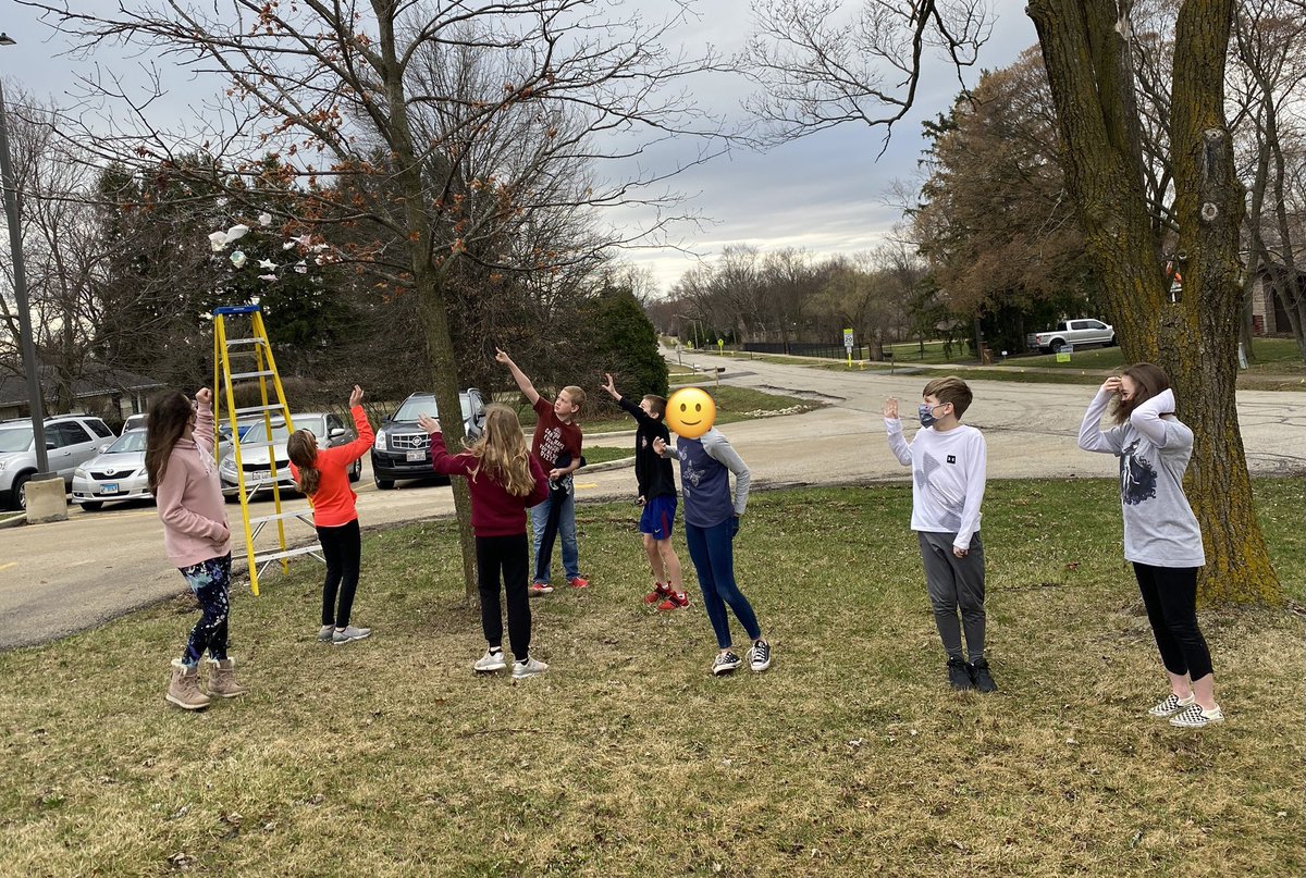 TeachMsErickson's tweet photo. We folded origami flowers, wrote our stressors, then hung them in a tree to say Farewell to them! We used biodegradable paper and string. Here are some pictures from #FarewellDay @McDermottdg58 #dg58pride #BArocks https://t.co/XDSxKx4tQq