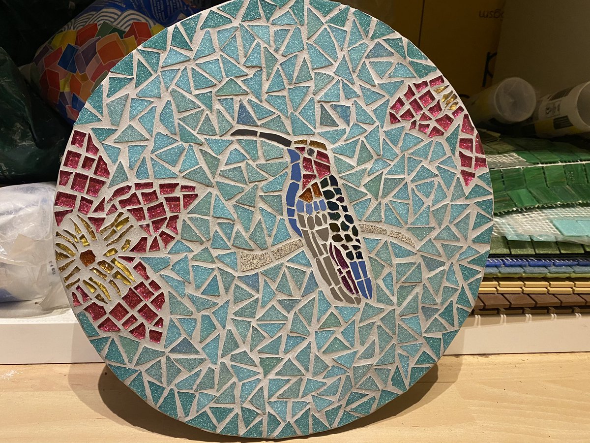 TrishGlenn's tweet photo. Ta da! I love how mosaics look different in different light, the way they catch the eye and sparkle or look more subtle and subdued. A mango hummingbird made for a dear friend with love. #lockdowntherapy https://t.co/g8jP8uRqwu