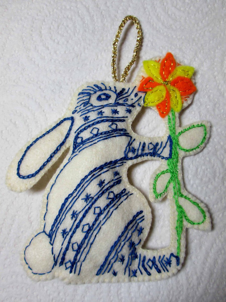 PrettyHops_Jump's tweet photo. This cute bunny smelling a flower was inspired by a drawing I did. He comes in other colours and can have a name added https://t.co/fHJ0bssO8K #handmadehour #gift https://t.co/EhFgrRGlDg