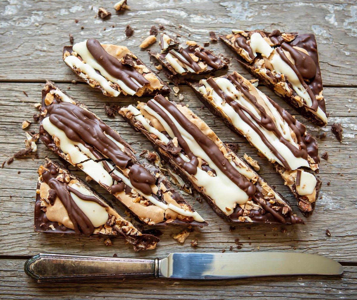 coltschocolates's tweet photo. There aren’t many Easter treats around as smooth as our decadent PB Almond Bella Bark!

Crispy rice cereal is folded into a milk chocolate base. Next it is topped with roasted almonds before being covered in peanut butter. As a final touch, we add a white &amp; milk chocolate drizzle https://t.co/JE5dSOe1JS
