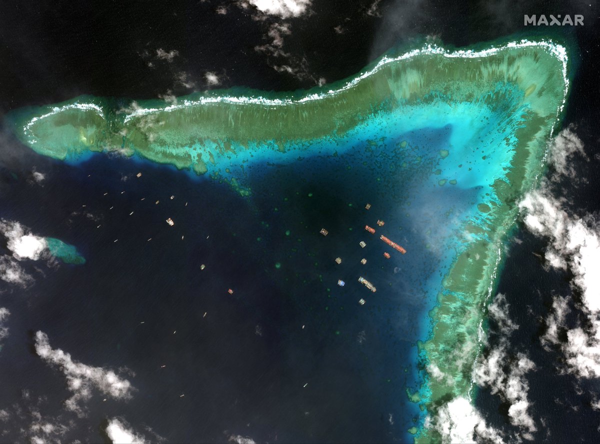 TostevinM's tweet photo. A large group of Chinese vessels not fishing at a reef within Manila’s 200-mile exclusive economic zone that is also claimed by Vietnam https://t.co/URNaCAzVXP pictures by @Maxar via @reuterspictures https://t.co/w0nZzKWRlg