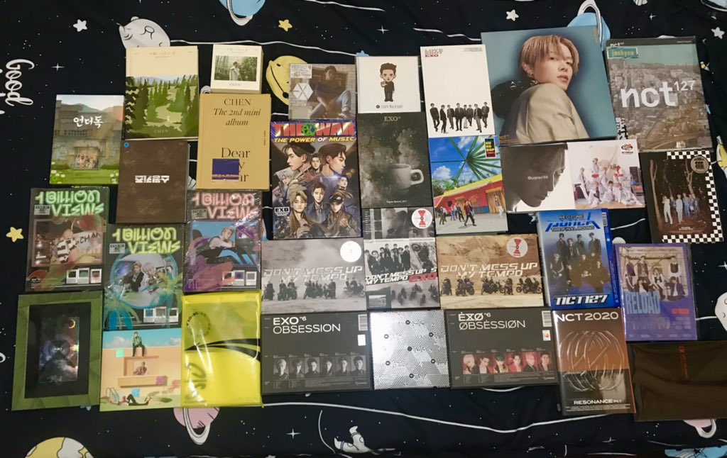 gelibeeeee's tweet photo. im cleaning my room rn and i realized that i have a lot of exo x nct albums already 😭 sana makain ko to pag wala na kong pera 😂😂😂 https://t.co/Z2AO0Nt5il