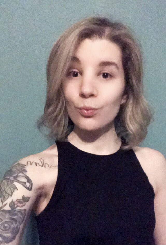 Selfie showing off my new short blonde bob cut.