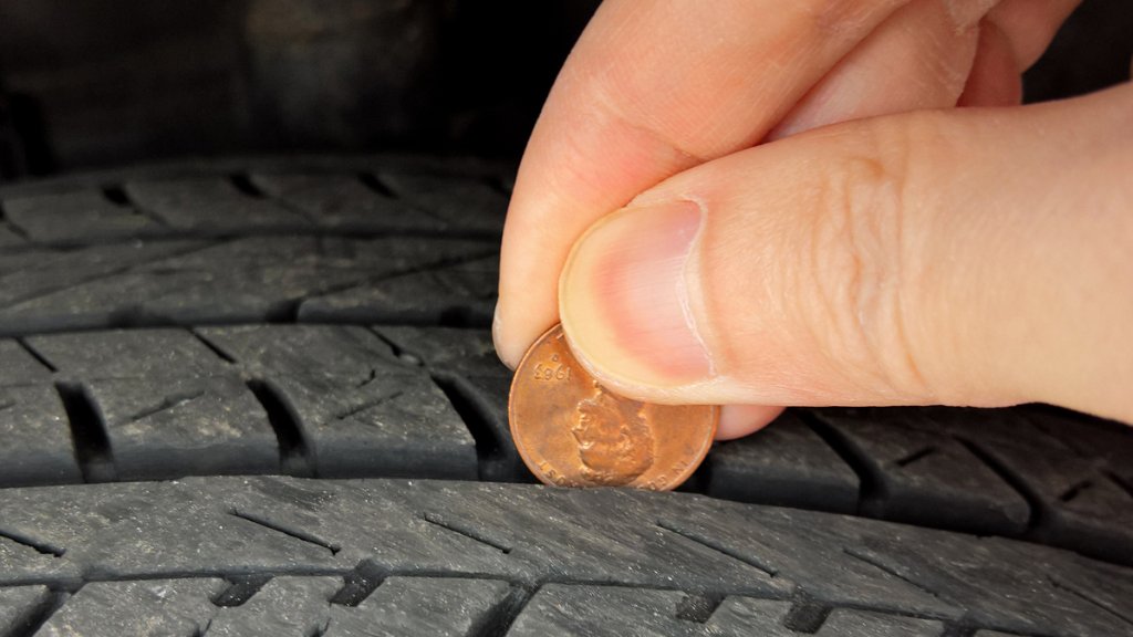 Allstate's tweet photo. Tires need to be replaced? Insert a penny headfirst. If any part of Lincoln’s head is obscured, you’re in good hands. If not, you need new tires. https://t.co/RJJzz8Rtrn