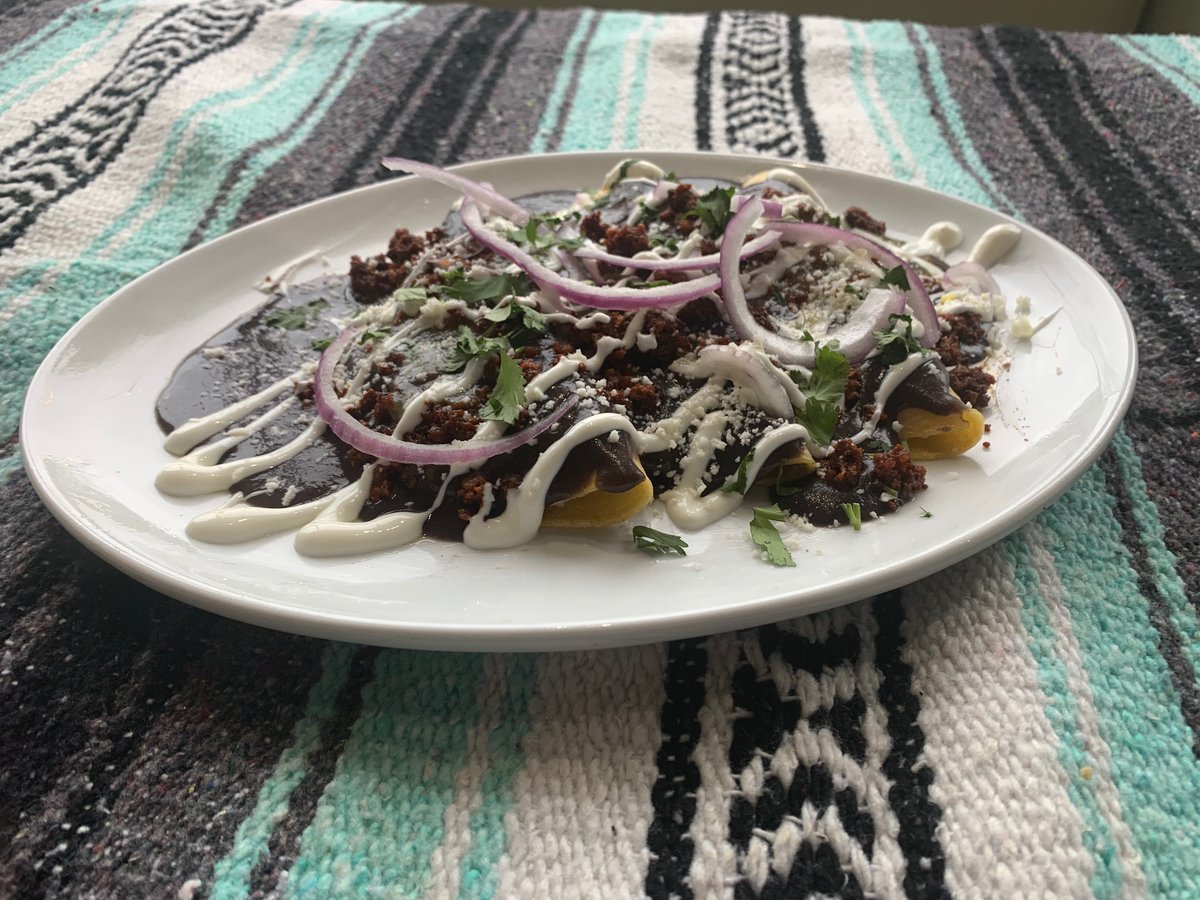 Masa of the day - Enfrijoladas;  3 tortillas filled with Oaxacan Cheese and topped with Black Bean/Hoja Santa Sauce, Salsa Verde, Pork Chorizo, Sour Cream, Queso Fresco and Red Onion