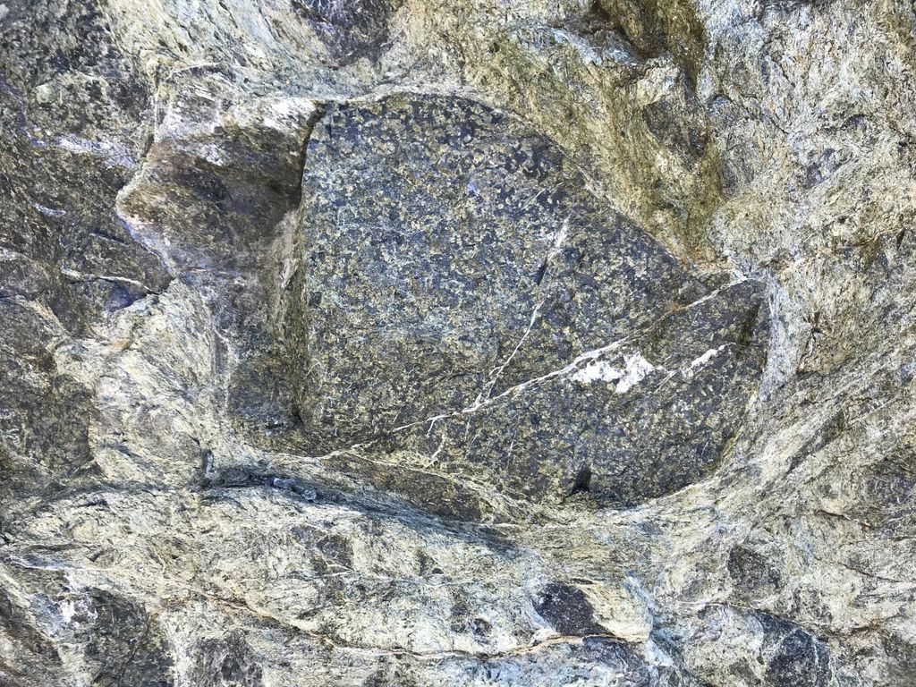 EPMGMonash's tweet photo. We are staying more local for #FieldworkFriday and traveling to Port Macquarie, Australia 🌏 Port Macquarie is one of the only places in Aus where you can see a semi-serpentinised peridotite #clast being anastomosed by a #serpentinite matrix #geology #science @geology_martin https://t.co/wPYjo2A3u8