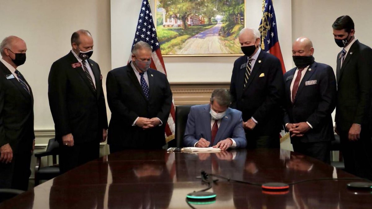 TalbertSwan's tweet photo. The only thing missing were the hoods and white robes at the ceremony where GA Governor Brian Kemp codified Jim Crow voter suppression tactics into law. https://t.co/Ojg3z2Tkow