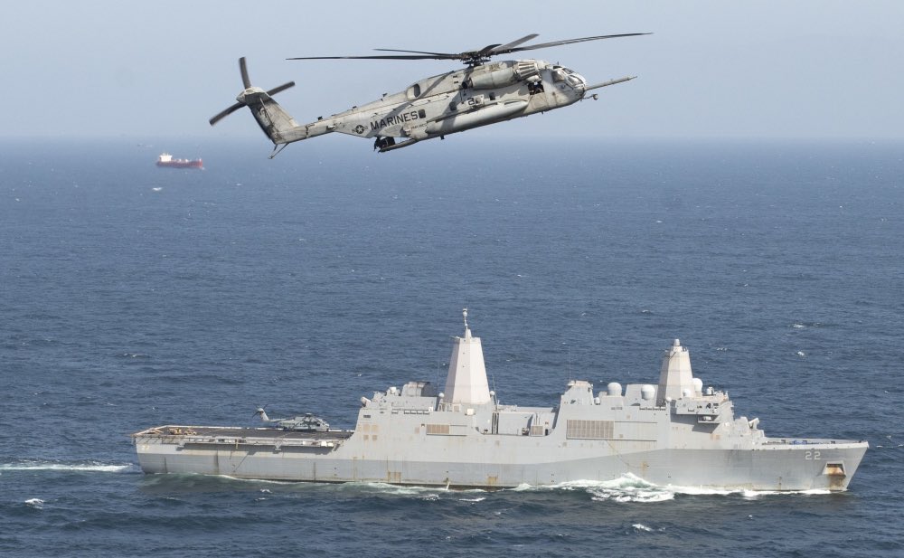 US5thFleet's tweet photo. #BlueGreenTeam ensuring maritime security in critical waters.

@USMC CH-53E Super Stallion attached to Marine Medium Tiltrotor Squadron 164 (Reinforced) flies above amphibious transport dock ship USS San Diego (LPD 22) during a routine transit patrol in support of @IMSC_Sentinel https://t.co/8cIjUXslr0