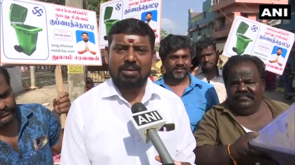 ANI's tweet photo. Tamil Nadu: Thulam Saravanan, an independent candidate from Madurai South constituency, says, "I promise a helicopter &amp; car for every house, a three-story house &amp; a trip to the moon. People ask me if all this is possible. I believe it is possible but will cost us a little extra." https://t.co/KvAUCUqryz