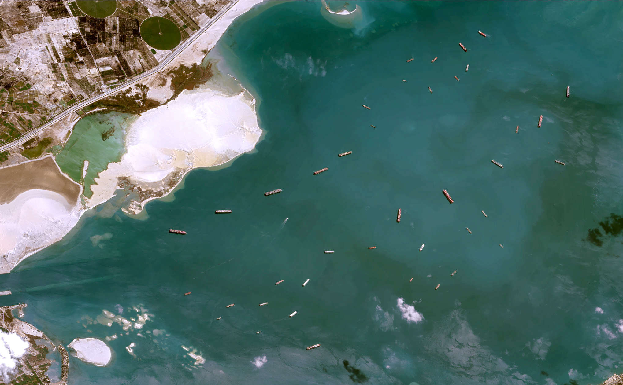 The Suez canal traffic jam as seen from Space with the satellite Pléiades built and operated by Airbus.<br />Pléiades is an optical satellite constellation providing very high-resolution products (50cm) with a 20km swath.