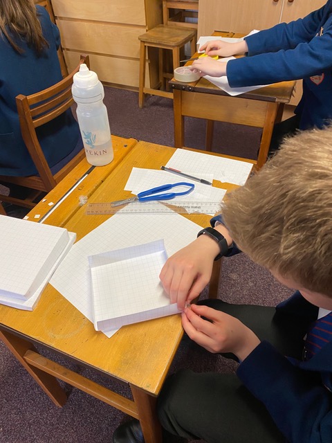 CastleHouseSch's tweet photo. All week long in Maths, the Year 6 children have been looking at using and applying their mathematical knowledge to solve problems. Today they explored how they could construct different size boxes from a 20 x 20cm piece of paper.

#Year6 #Maths #Academic #Learning #Telfordwrekin https://t.co/m8xhBSu2Dy