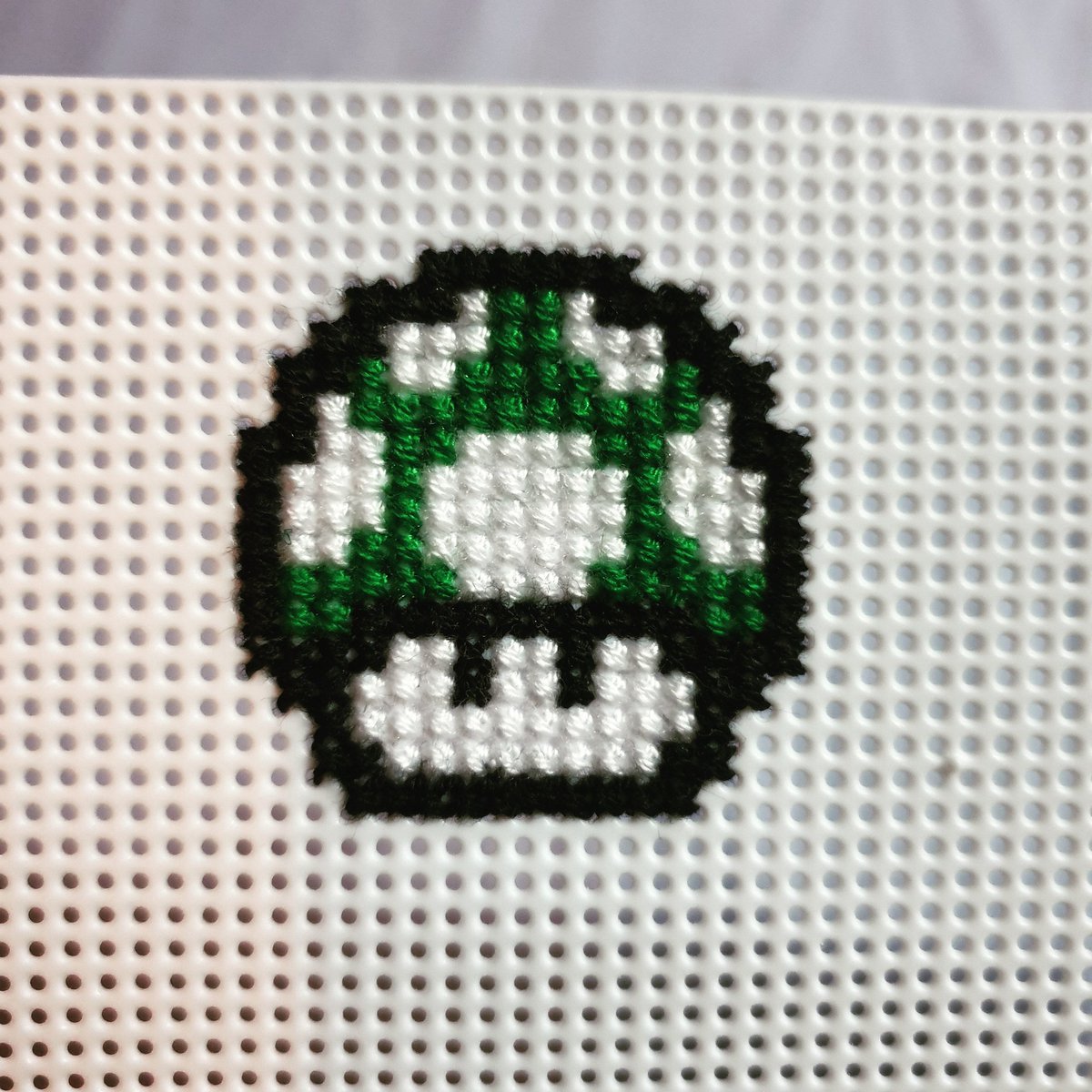 geek_tis's tweet photo. Bought some plastic 14ct aida and cross stitched a mini Mario mushroom to make into a badge! Jist need to buy some badge backs and figure out how I'm going to attach it! 😊🍄 #nintendo #1up #1upmushroom #mario #mushroom #mariomushroom #crossstitch #crossstitcher #crossstitching https://t.co/uQ9SkjVI3Q