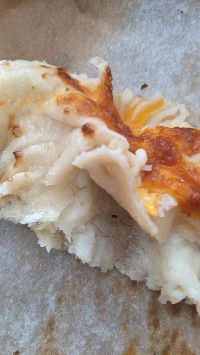 gahanguru's tweet photo. @dominos ordered a stuffed cheesy bread, got a hair stuffed bread. Joke Aside, this is disgusting. https://t.co/voSaxEZgk1