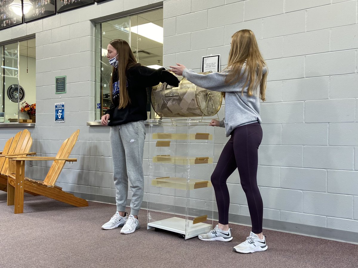 Senior Kylee Sallee assists senior Sara Hansen in drawing the winner of the post-prom raffle #hudsonschools (jc)