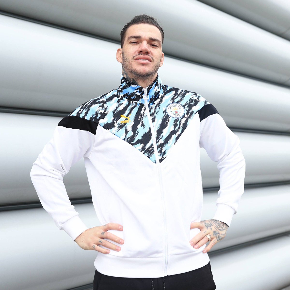 ManCity's tweet photo. .@edersonmoraes93 rocking the new @pumafootball Iconic jacket during international break 🤩🇧🇷 https://t.co/EvLl5Z8uBl
