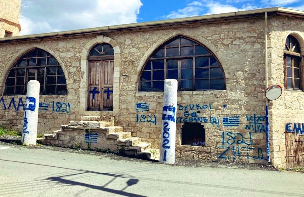 Greek flags were drawn by unidentified people and racist slogans were written on a mosque wall in the village of Yalova in the city of Limassol, Southern Cyprus.