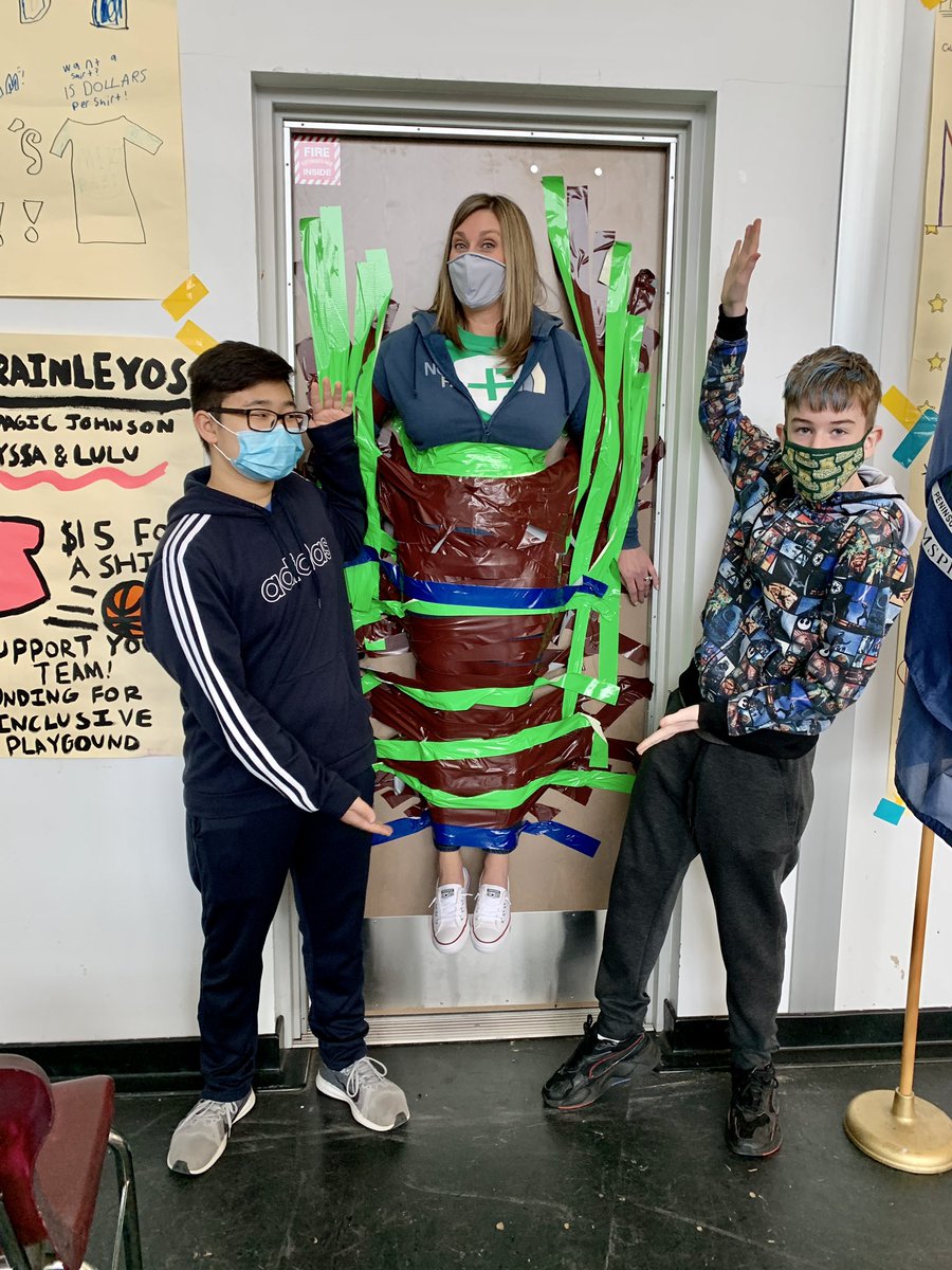 KelliFallsChoir's tweet photo. Danielle Schmidt taped to the wall...  Encore Team wins this challenge. Go Lindsey Hund!  Represent!!!  Together the 8th grade made $82 !!! https://t.co/9OefSRwvpv