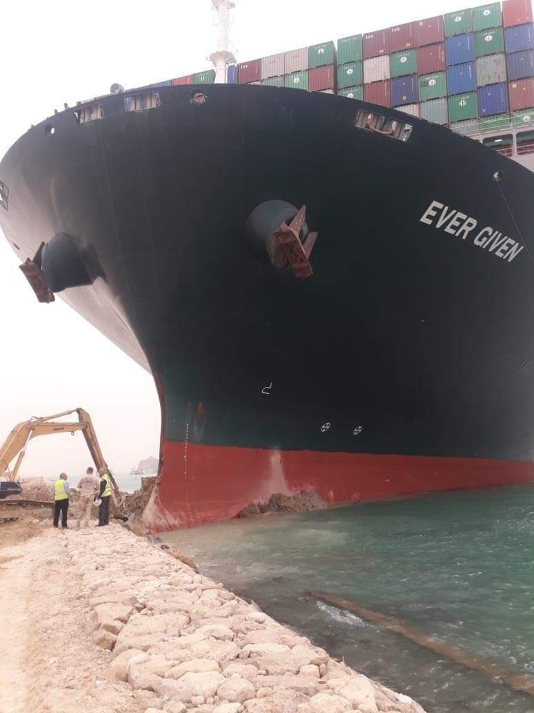 LCCrowd's tweet image. One of the largest ships in the world creating a blockage in the Suez Canal that is visible from space and we have Wall-E trying to dig it out.