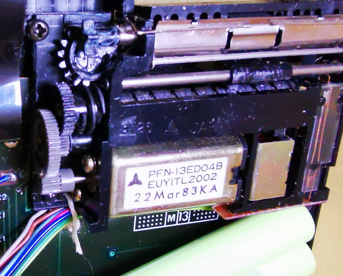 swartz_de's tweet photo. So, inside the case, the NiCd looks gnarly, but I've seen worse. I swapped in a new battery pack, but a gear on the printer mechanism is broken, as is often the case with these printers. Does anyone know who made these printer modules? #Casio #fx802p #fp12 #ポケコン https://t.co/MRVBh4S97k