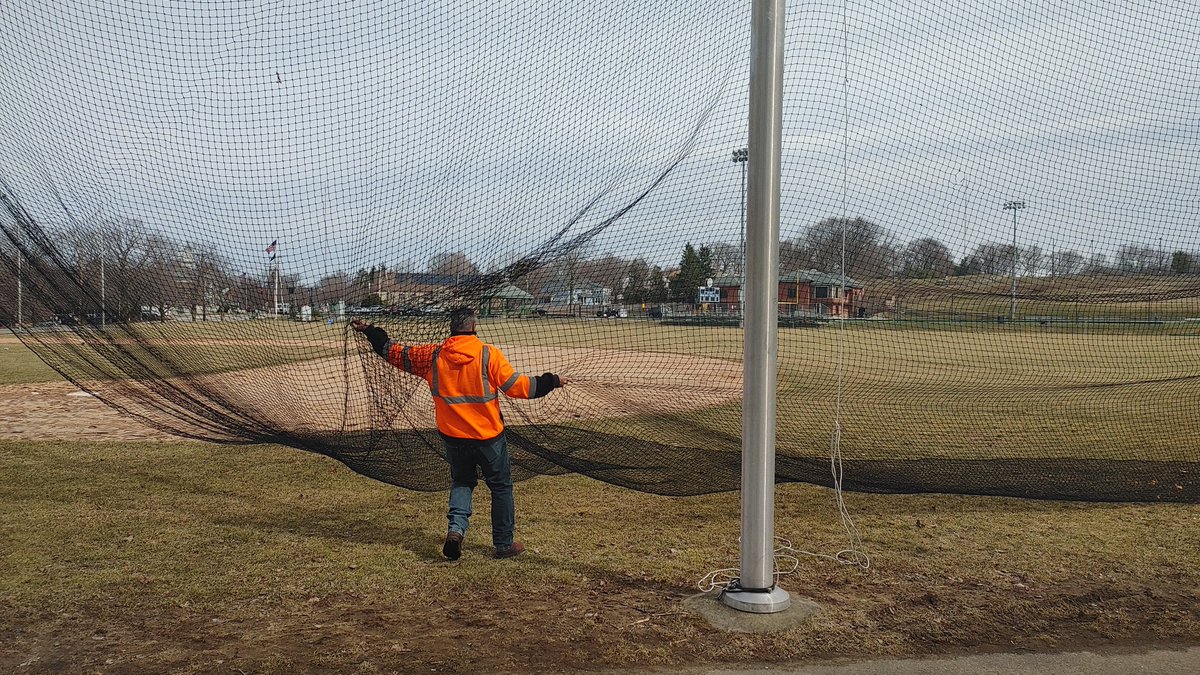 NeedhamDPW's tweet photo. #signsofspring #NeedhamDPW #PublicWorksMakesItHappen
Our Parks &amp; Forestry team has been busy all week prepping the fields around Town. 
The team installed safety and ballfield nets, painted and installed barrels, &amp; painted various sports fields. https://t.co/lmlUwMOYoJ