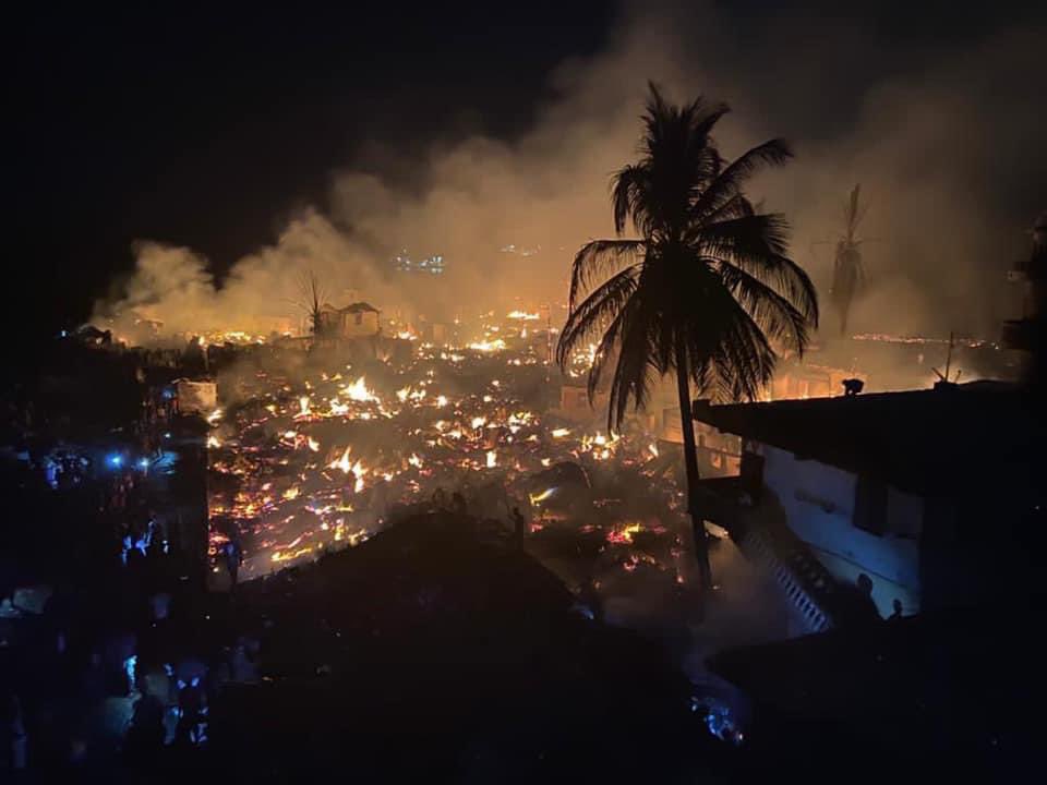 WharfKids's tweet photo. Desperately sad - huge fire ripped through Susan’s Bay two nights ago. Not Magazine Wharf thankfully, but are tragic reminder of the fire risks in these unplanned and overcrowded housing areas. Thoughts with all those affected. https://t.co/SNF96XF6Kn
