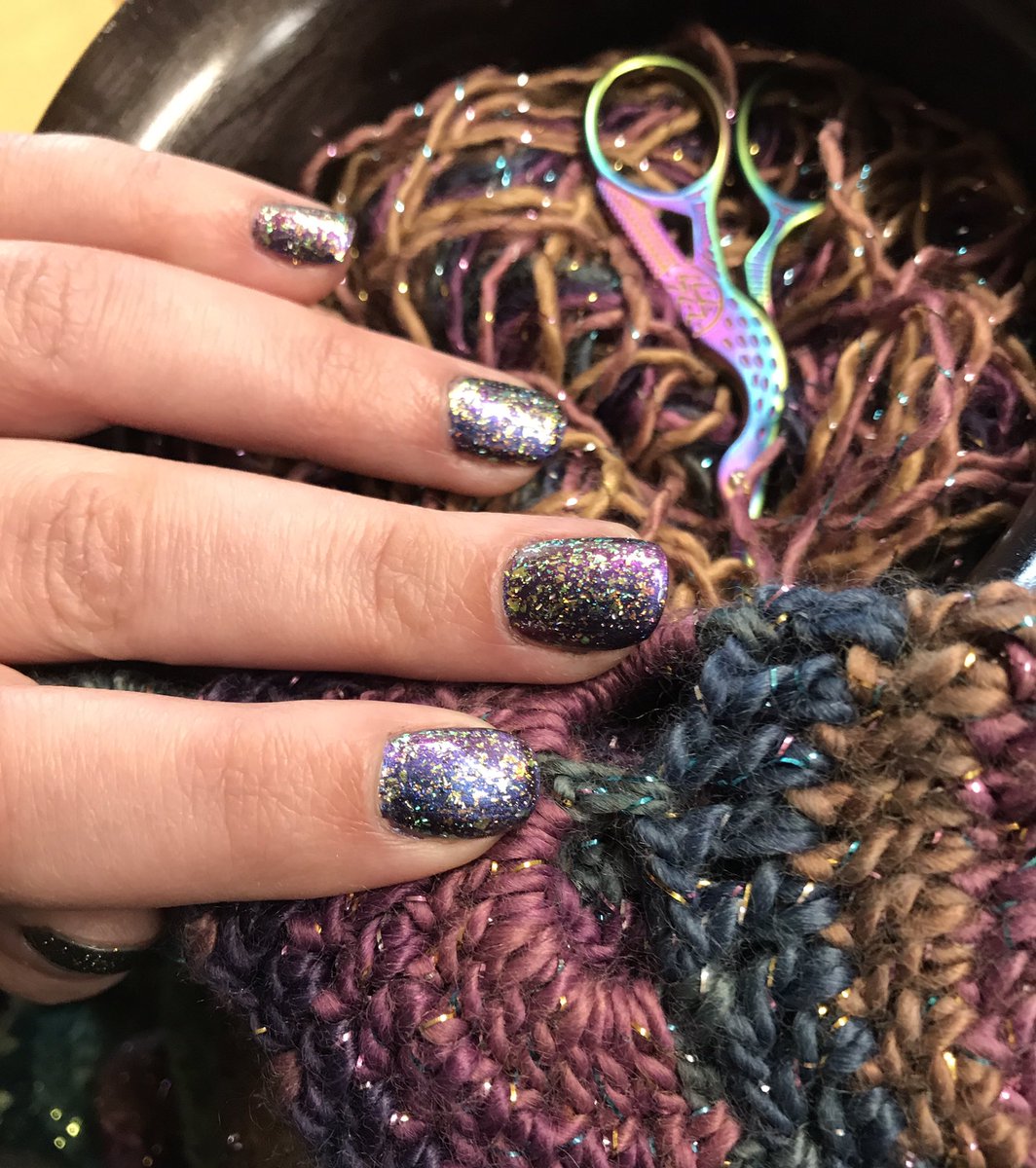 LaurMarquez11's tweet photo. Okay @holotaco @nailogical , tell me I didn’t just find the best #holotacocombo to go with this yarn I’m using to make a blanket. 
Lunar Unicorn Skin and Flakie Taco over Purple With Envy was an accidental perfect match for my “underwater rainbow” yarn 🧶 🌈 💿 https://t.co/PdBqrtwtNa