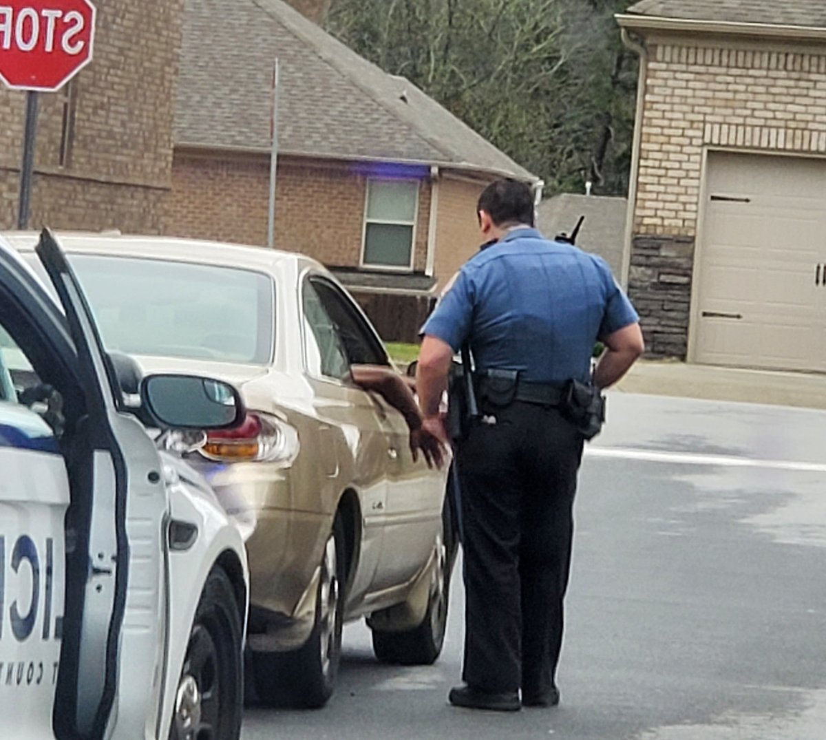 AltonJRoberts's tweet photo. Pulling into my suburban GA  neighborhood, two police officers have an African American pulled over, the kid immediately places both hands/arms out the window, as to say "see my hands, don't shoot me". Are we traumatized? #BlackLivesMatter https://t.co/9fm5BzGmCo