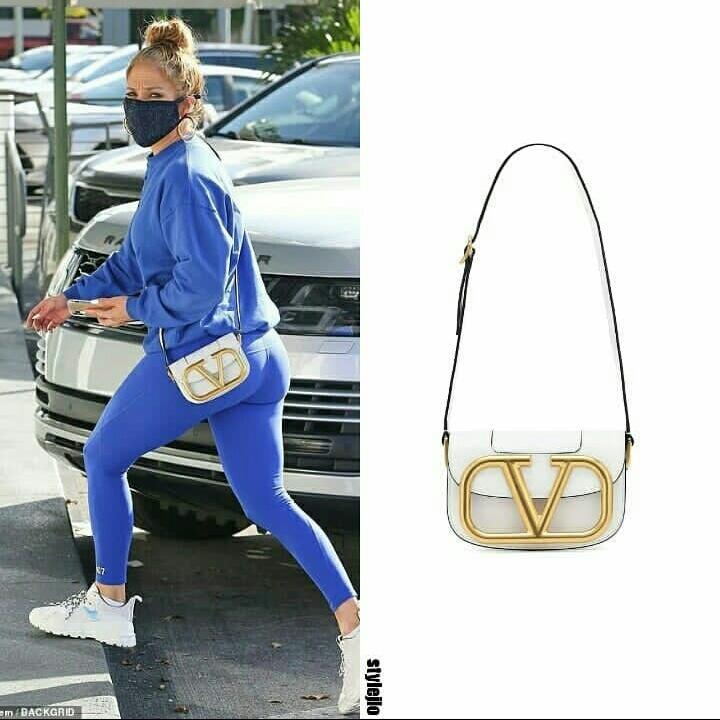 style_jlo's tweet photo. 24th December, 2020  @jlo  Miami 
She's wearing #masqd Crystal Face Mask in Navy Blue (out of stock)
#masqd Crystal Face Mask in Silvery (20.00$)
@MaisonValentino Supervee White Bag (out of stock)
#johngeiger All White 003 Sneakers (not released yet)
#JenniferLopez https://t.co/7Er1WuVvde