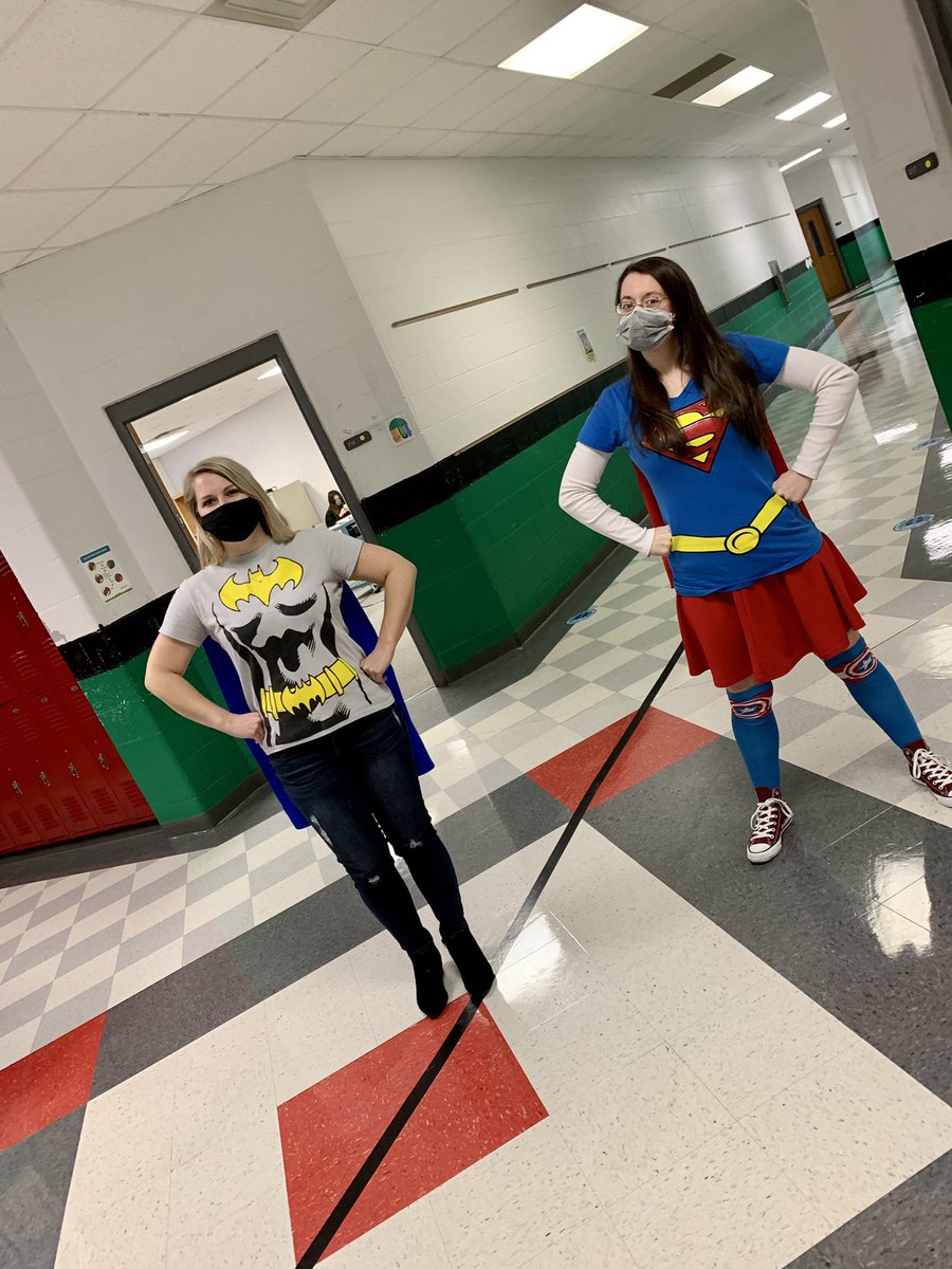 LangerMath's tweet photo. We wrapped up Spirit Week at @westcaryimps with SUPERHERO day! @tmhill03 and I twined it with a Supergirl and Batgirl combo! (Not planned, but it couldn’t have worked out better!) 😁💚🤍🖤 #SuperIMP #6thGradeRocks #DC #HelloSpringBreak https://t.co/GdEjCkFliP