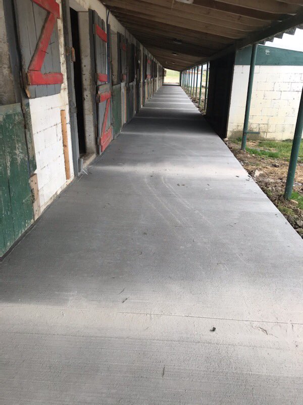 Track work continues but we wanted to share one of our other projects going on - new concrete aisleways in the ship-in barns!