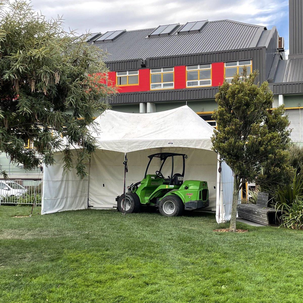 Only in New Zealand would taxpayers pay for a marquee to protect a compact loader! #pukeahu