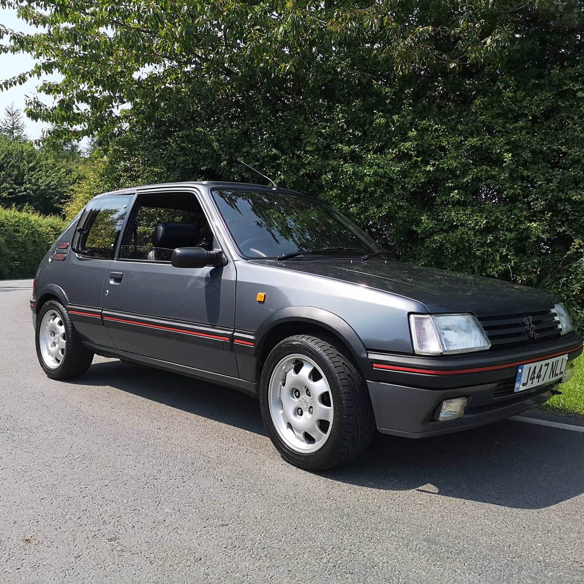 B-Road blast, 90s style! #classiccars #peugeot #205gti #retro #retroclothing #rayban #clubmaster
