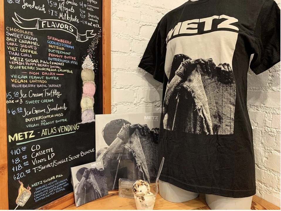 A long standing friendship between Canada's <a href="/METZtheband/">METZtheband</a> and <a href="/mdiicecream/">Mount Desert Island Ice Cream</a> has spawned a new flavor: Sugar Pill! Named for the song on the latest METZ album Atlas Vending. The flavor is like an elevated S'mores. Atlas Vending and commemorative T-Shirts  available at our DC store.