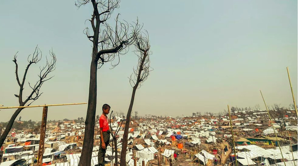 bs2000sa's tweet photo. #ARohingya refugee child stands by his burnt home days after a fire at a refugee camp in #Bangladesh's southeastern #CoxsBazar district Munir Uz zaman AFP https://t.co/yeHmQvHw3e