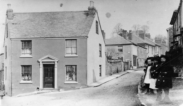 The junction of Church Street and Belle Vue Road (previously Batts Lane) with some interested onlookers on the raised pavement on the right, probably c. 1890 (P00725). The corner house and the general street layout are little changed.