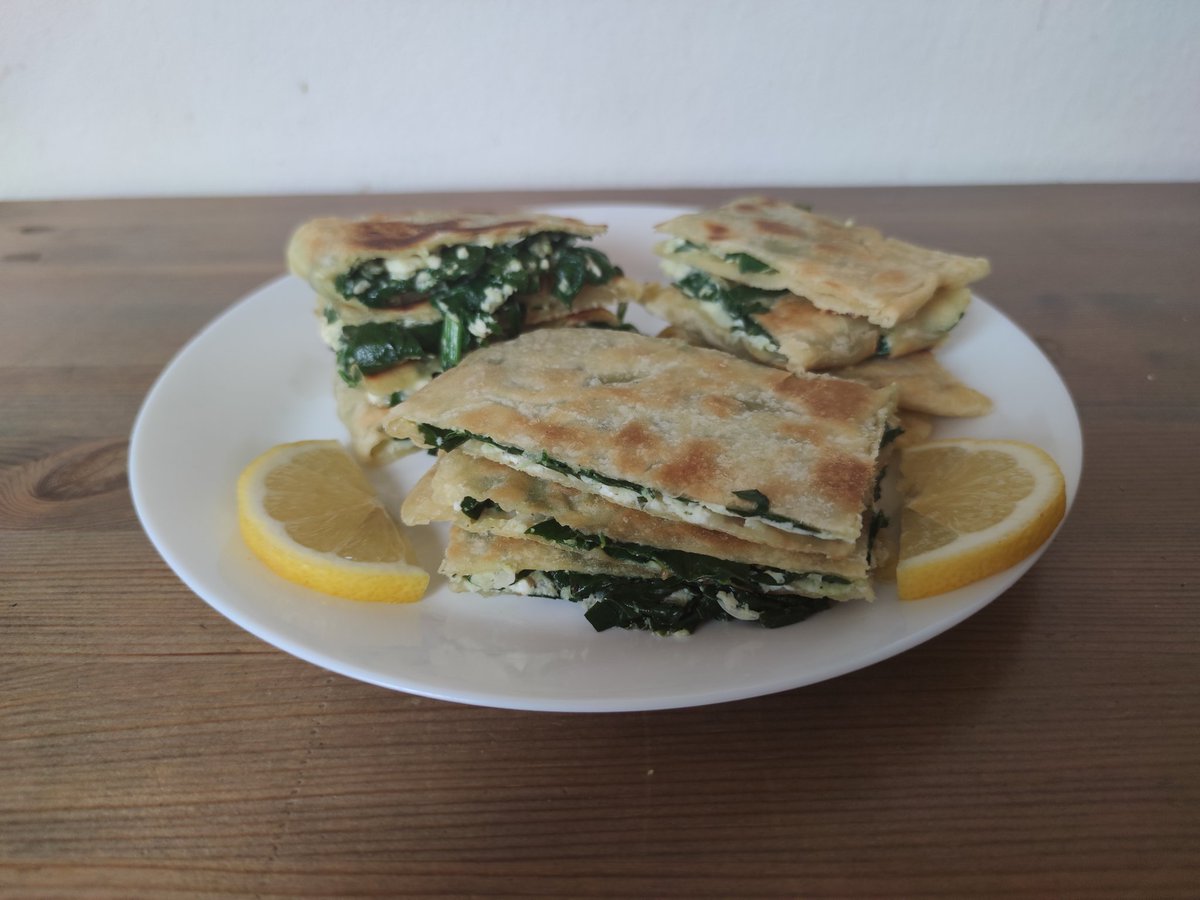 CTJFerguson's tweet photo. Day 6 in The Middle East on our #worldfoodtour #ChemistsWhoCook. Brunch was spinach and feta gozleme (filled fried pastry). Dinner was koosa mahshi (rice stuffed courgette and pepper) followed by sholeh zard (saffron and rose rice pudding). Just in time for #SocialIsolationSocial https://t.co/ROPqfyt9Zc