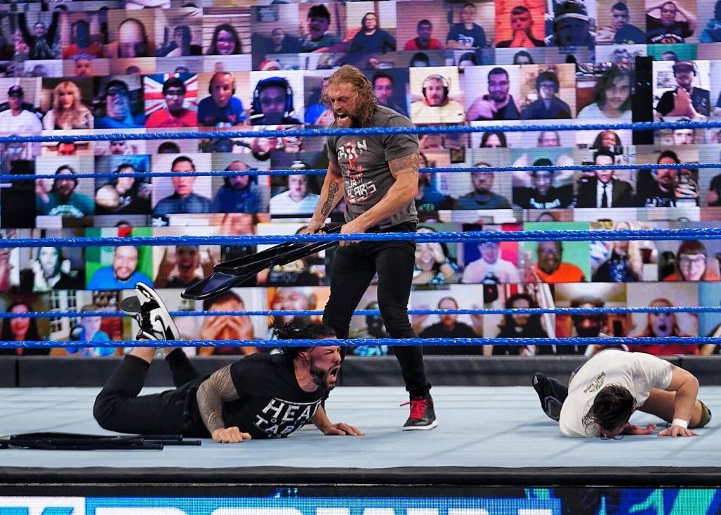 WWE's tweet photo. To say that @EdgeRatedR is "unhappy" about @WWEDanielBryan joining the #UniversalTitle bout at #WrestleMania would be an absolute understatement. #SmackDown @WWERomanReigns @HeymanHustle https://t.co/StkWzMzTRa